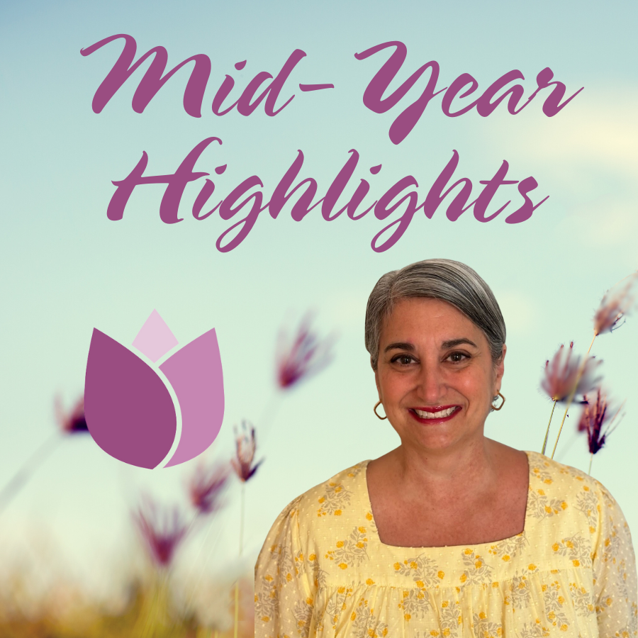 woman in yellow shirt in front of field of flowers