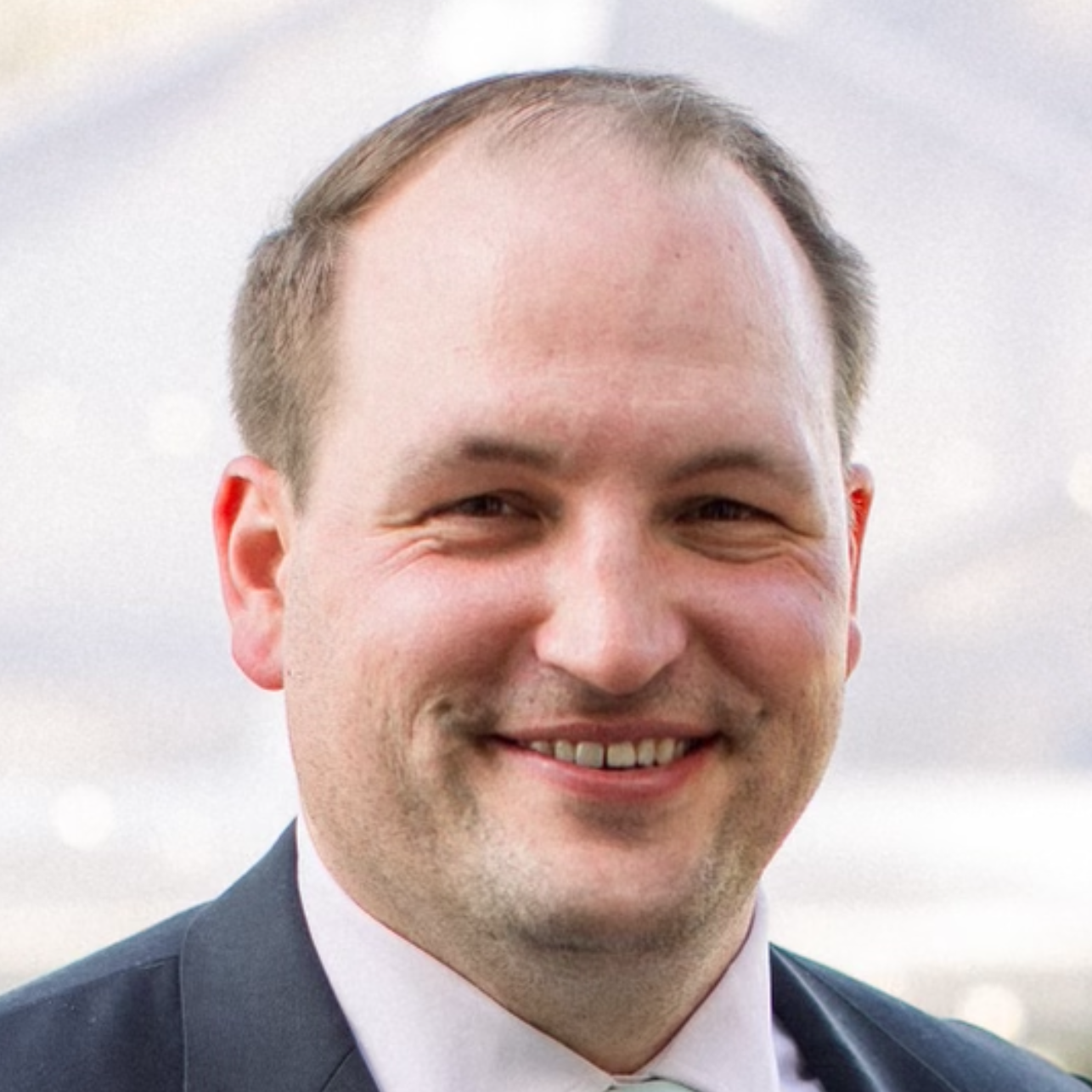 Todd Hozza, a white man in a suit